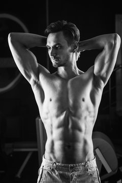 Strong Muscular man with naked torso abs . Black and white photo.