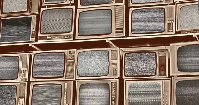Wall of old wooden black and white TV screens, static noise caused by bad signal reception