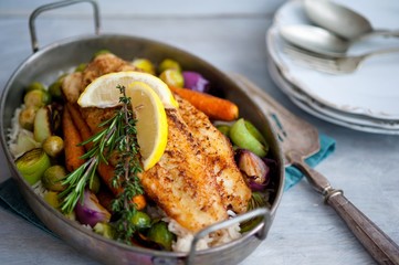 fried fish with rice and vegetables