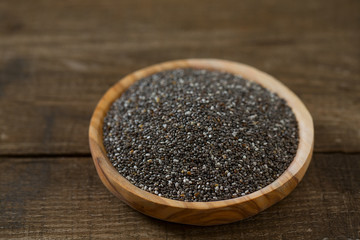  Chia seeds on a wooden surface