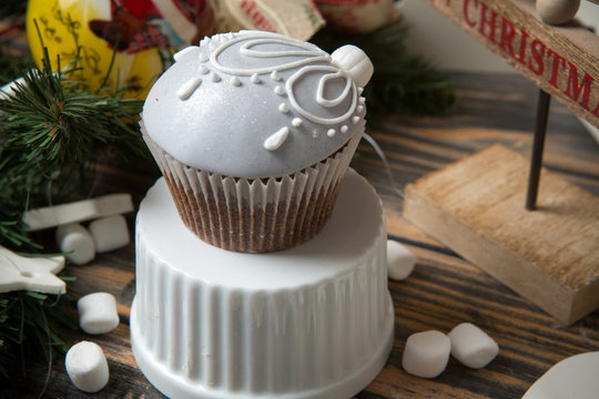 Cupcake on christmas decorated wooden table