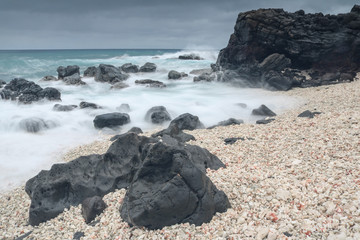 Fototapeta na wymiar Pebble beach at Kaena Point in Oahu, Hawaii