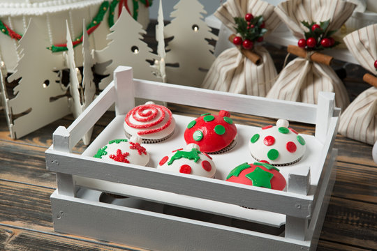 Cupcakes on christmas decorated wooden table