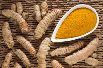 Roots and turmeric powder - Curcuma longa