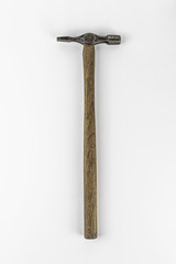 Old vintage hammer shot from above against a white background.