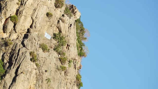 Greek flag on rock in Taygetus mountains Greece Peloponnese, Europe 4K