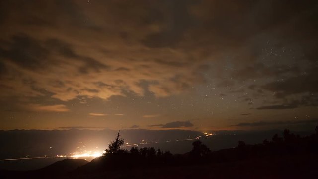 Time Lapse of the stars above the glowing town of Bishop in California.
