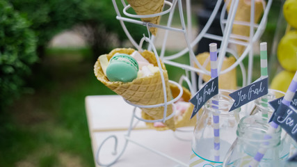 Details of a tasty candy bar with jugs of sweets, cookies and marshmallows, Candy, waffles, cookies...