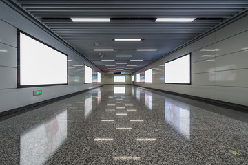 modern hallway of airport or subway station with blank billboards on wall