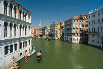 view of the canal with a gondola in Venice