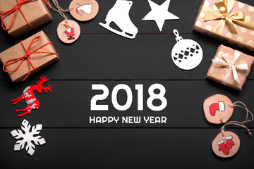 New year's background on a white desk decorated with toys, presents, Santa Claus, snowman. Bright colored background symbolizes the new year celebration. Great useful template to wright words down.