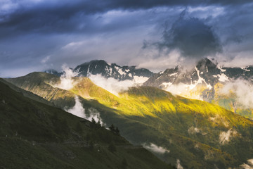 Cloudy sky with sun rays in Gavia Pass, Valfurva, Valtellina, Lombardy, Italy