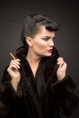 Obraz premium Beautiful lady with cigarette in fur coat. Cyberpunk theme. 