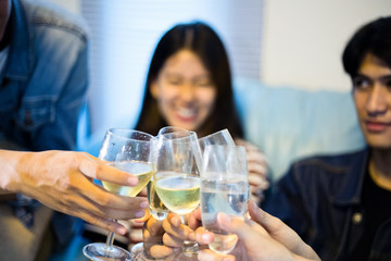 Asian group of friends having party with alcoholic beer drinks and Young people enjoying at a bar toasting cocktails.soft focus