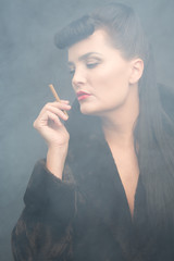 Obraz premium Cyberpunk themed beautiful girl with cigarette. Smoke environment.