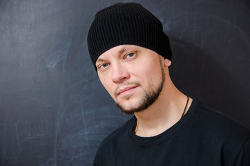 young attractive man in black with a confident look