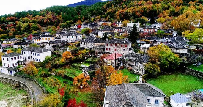 Aerial flight with drone over the old stone houses in the village Papingo, Greece