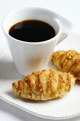 Salted caramel croissants and cup of coffee