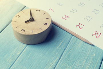 close up of calendar and clock on the table, planning for business meeting or travel planning...