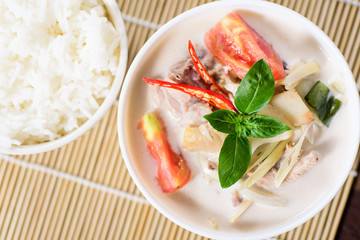 Thai food (Tom Kha Kai), Thai coconut milk soup with chicken and cooked rice © nungning20
