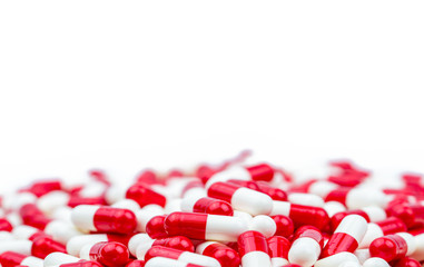 Selective focus of antibiotic capsules pills on white background with copy space. Drug resistance concept. Antibiotics drug use with reasonable and global healthcare concept.