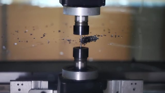 Machine digging plexiglass