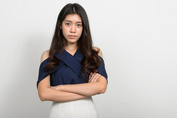 Fototapeta premium Portrait of young beautiful Asian woman against white background