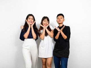 Group Of Three Young Asian Woman Indoors Against White Background