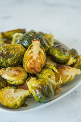 Cooked Brussels sprouts in a white plate
