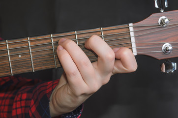  Musician Playing accord C on acoustic guitar, close up