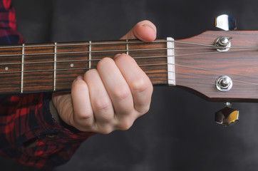  Musician Playing accord A on acoustic guitar, close up