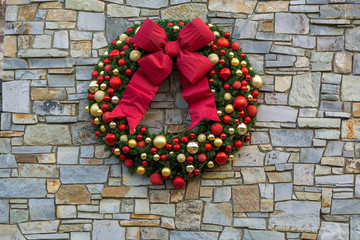 Christmas Holiday Wreath on Stone Wall