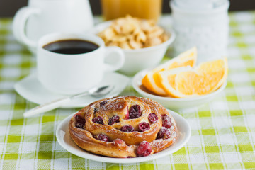 Cup of coffee, muesli, baking and orange juice