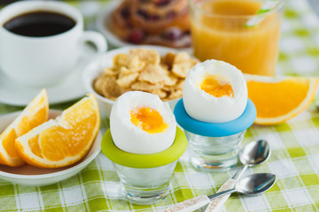 Soft boiled chicken egg, coffee, muesli and orange juice
