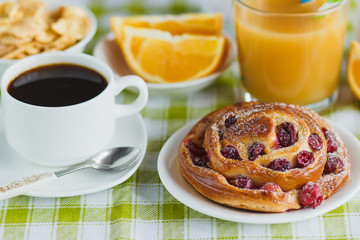 Cup of coffee, muesli, baking and orange juice