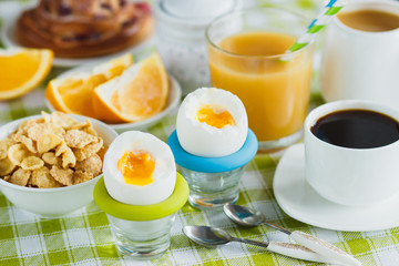 Soft boiled chicken egg, coffee, muesli and orange juice