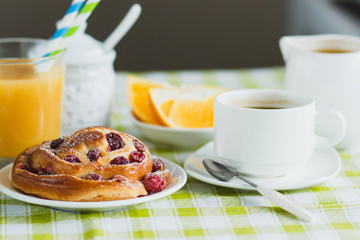 Cup of coffee, muesli, baking and orange juice