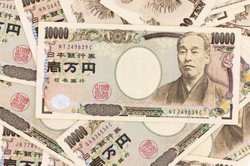 Japanese currency yen bank notes. The yen is the official currency of Japan. It is the third most traded currency in the foreign exchange market after the United States dollar and the euro