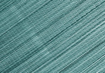 Obraz premium Cyan toned straw mat surface.