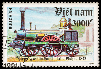 Fototapeta na wymiar Old postage stamp with retro steam german locomotive and railway, printed in Vietnam in 1991