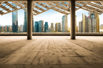 cityscape of modern city at dawn from empty floor