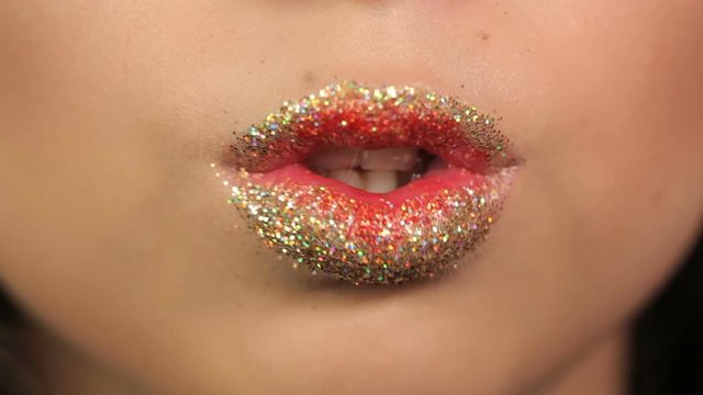 lips young girls wearing sequins. her lips were slightly parted and the white teeth