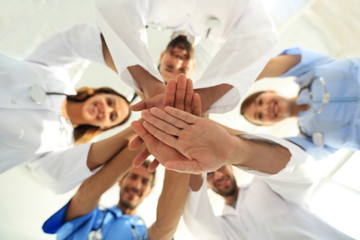 Obraz na płótnie Canvas bottom view. close up of a doctors folded their hands together