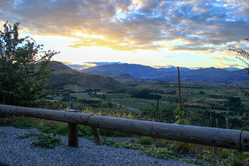 Fototapeta na wymiar stunning sunset over the mountains, view from the road