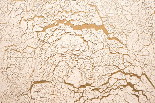 Cracks on the wall. Gold design background.