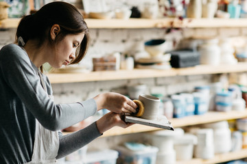 Woman Working At Pottery Studio