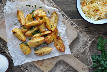 Baked potatoes with garlic, paprika and fresh parsley