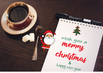 merry christmas and happy new year, with santa on notebook
