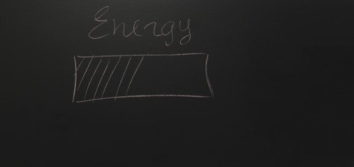 drawn a battery on a blackboard with text: Energy