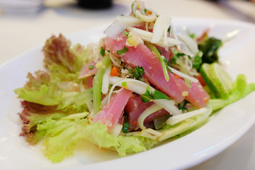Delicious fresh tuna tataki salad with reflection